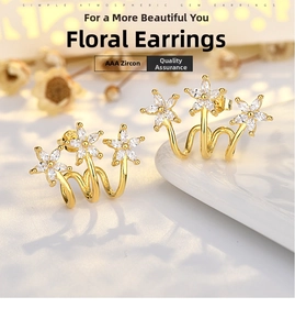 Detailed view of triple flower ear crawler in gold finish with sparkling AAA zirconias