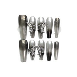 Silver and black gradient press-on nails with 3D butterfly charms and black gemstones