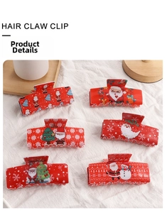 Collection of six red Christmas hair claw clips with Santa and snowflake patterns