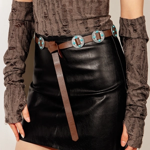 Detail of vintage brown leather belt with turquoise stone circular metal studs