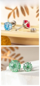 Makroaufnahme von 6/8mm Zirkonia-Ohrsteckern mit grünem, blauem und rotem Edelstein