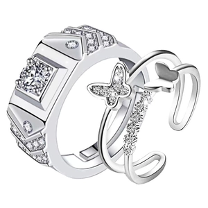 Macro detail of silver couple rings with butterfly design and square diamond setting