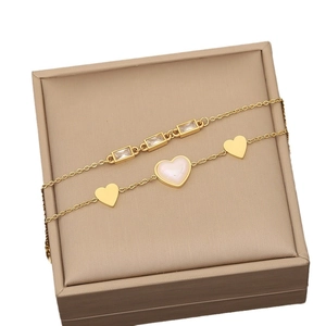 Double-layered gold stainless steel necklace with heart pendants and rectangle gemstones