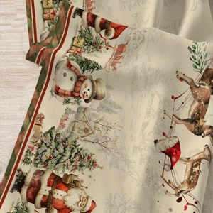 Detail of Christmas tablecloth showing vintage Santa and snowman print on cotton linen fabric