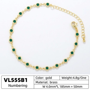Luxury gold brass bracelet featuring green round crystals with adjustable lobster clasp chain