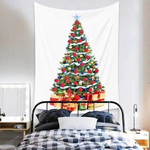 Detail view of a white Bohemian Christmas tree tapestry hanging above a bedroom bed