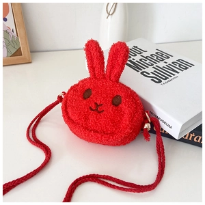 Detail of red plush bunny kids crossbody bag featuring textured sherpa fleece and embroidery