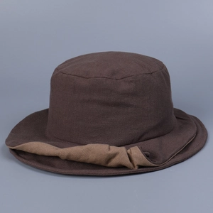 Detail view of double-layered brim and textured linen fabric on brown sun hat