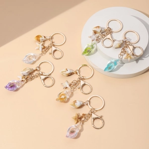 Detailed view of colorful luminous seashell and starfish keychains in various colors