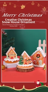 Detailed close-up of resin gingerbread house ornaments with miniature snowmen and trees