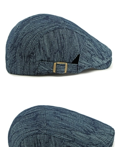 Detailed view of navy cotton denim beret with adjustable antique bronze metal buckle