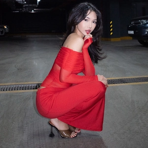 Chic red off-shoulder long sleeve mesh dress with hollow design worn by model