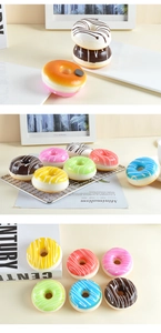 Macro detail of colorful PU foam faux donuts with realistic cream glaze and toppings