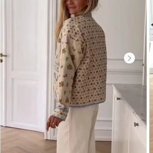 Chic quilted floral cardigan for women with blue contrast trim in cream beige