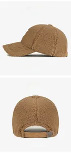 Detail view of brown sherpa baseball cap showing side profile and adjustable back strap