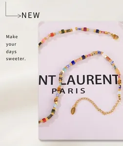 Close-up of multicolor stone bead necklace with gold stainless steel clasp and chain