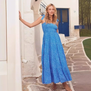 Elegant blue floral print backless maxi dress with adjustable straps and smocked bodice