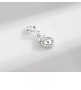 Detailed macro of S925 sterling silver heart lock pendant with micro-pave white zircons