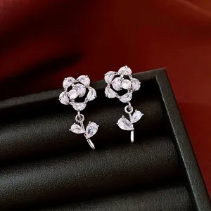 Elegant silver rose flower drop earrings with white zircon on black leather and silk