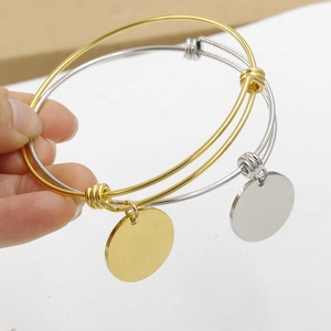 Adjustable gold and silver metal wire bracelets with blank round discs for DIY engraving
