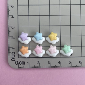 Mini resin star cloud charms for nail art and DIY crafts with ruler for size reference