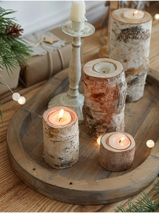 Set of four rustic birch wood candle holders with natural bark for Christmas home decor
