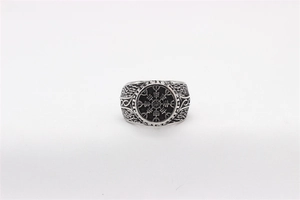 Macro shot of vintage silver Viking compass ring with Nordic braided texture details