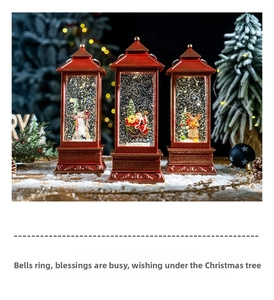 Three red vintage Christmas lanterns with Santa and snowman on snowy display