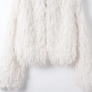 Women's white fuzzy jacket with metallic thread and long faux fur fringe texture