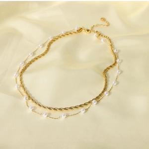 Detail of 18K gold-plated stainless steel layered chain necklace with white pearls
