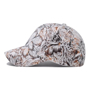 Neutral baseball cap with floral leaf print on white canvas and curved brim for sun protection