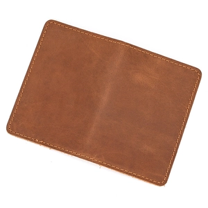 Close-up of premium brown leather texture with neat stitching and smooth surface finish