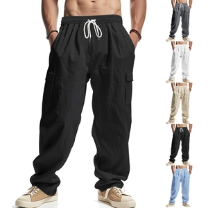 Detail of loose fit cargo pants with drawstring waist and multi-color fabric swatches