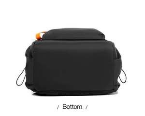 Detail view of the waterproof backpack bottom featuring orange handle and mesh fabric