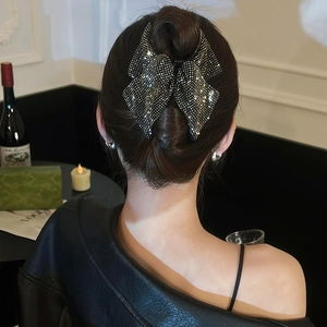 Elegant large black triangle hair claw with sparkling crystals for a sophisticated updo