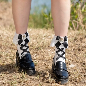 White Lolita lace socks featuring black bows and faux pearl rhinestone embellishments