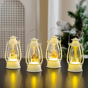 Illuminated white Christmas LED lanterns with warm yellow light and festive holiday prints