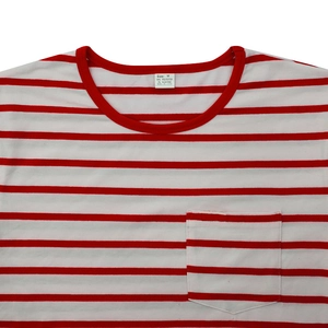 Detail of red and white striped t-shirt collar, chest pocket and washing label info
