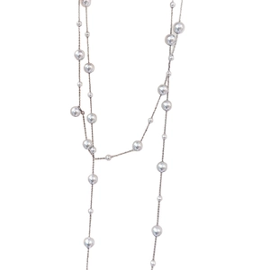 Elegant multi-layered necklace with glass beads and pearls on silver metal chain