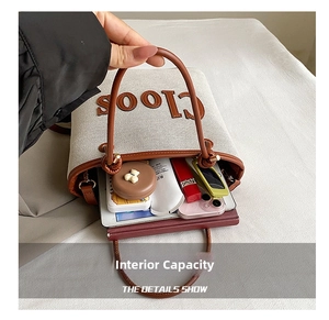 Detail shot of the large interior capacity of this canvas tote bag with brown leather trim