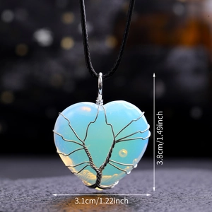 Detail view of heart-shaped opalite pendant with silver tree of life wire wrap design