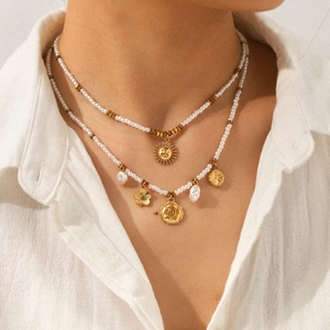Double-layered gold flower and pearl pendant necklace for women on minimalist model