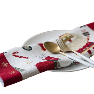 Christmas jacquard placemat with Santa Claus and reindeer patterns on a dining plate