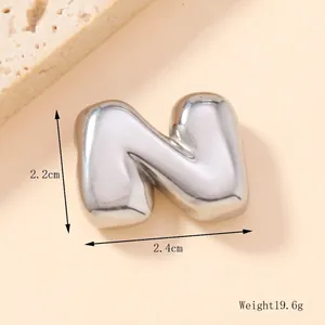 Detail of bubble letter N pendant with dimensions 2.4cm by 2.2cm and weight 19.6g