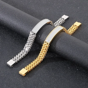 Detail of silver and gold woven link bracelets with rectangular id plates on leather