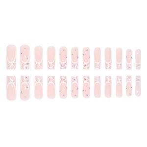 French long square press-on nails with nude pink base, silver glitter, and rhinestones