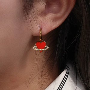 Gold stainless steel earring featuring a red heart planet pendant with zircon stones
