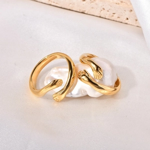 Gold-plated titanium hug ring set featuring a large baroque pearl on elegant silk