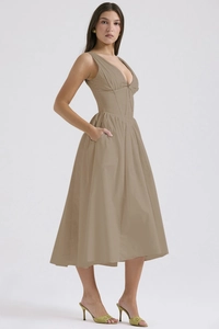 Close-up of khaki V-neck slim-fit maxi dress highlighting tailored waist and flowing fabric