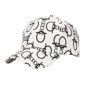 Detail of white baseball cap with black interlocking geometric digital print patterns
